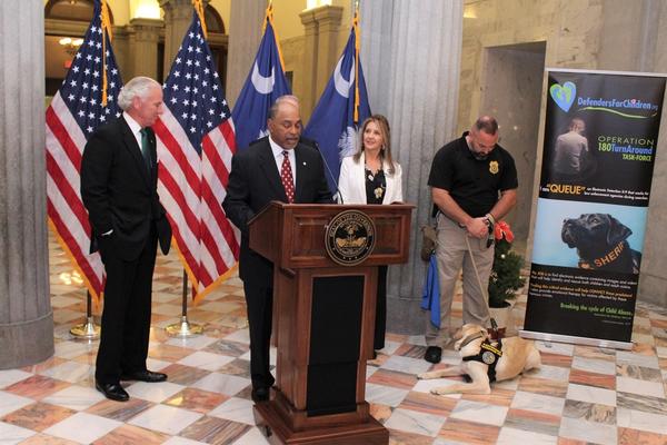 SCDPPPS Director Jerry Adger giving a speech from behind a podium.