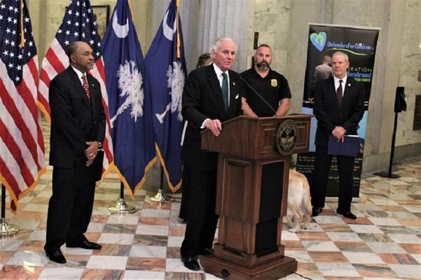 South Carolina Governor Henry McMaster giving a speech from behind a podium.